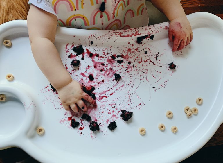 baby making a mess of food